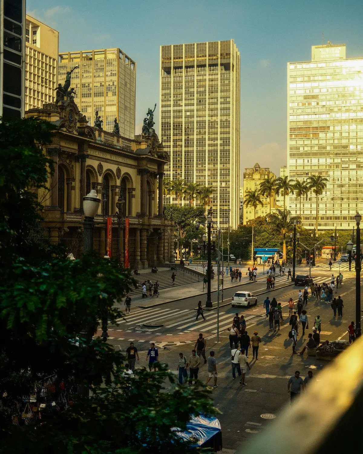 Municipal Theater of São Paulo in the late afternoon light, with the square and downtown buildings
